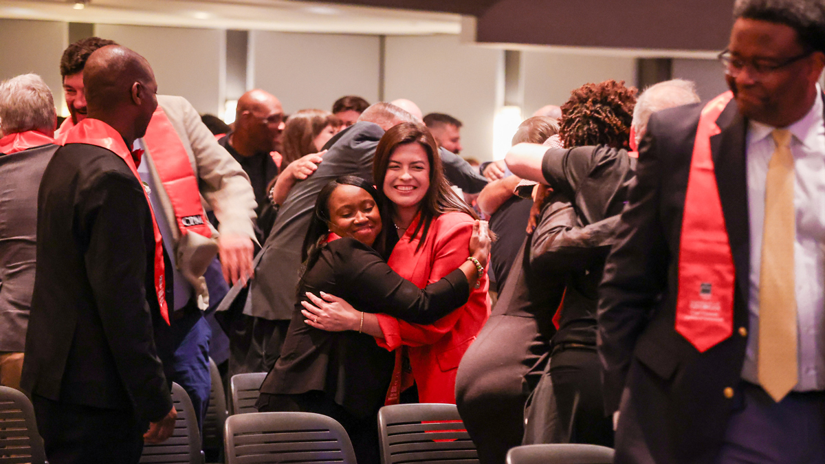 CPM graduates celebrate at their graduation ceremony in Athens.