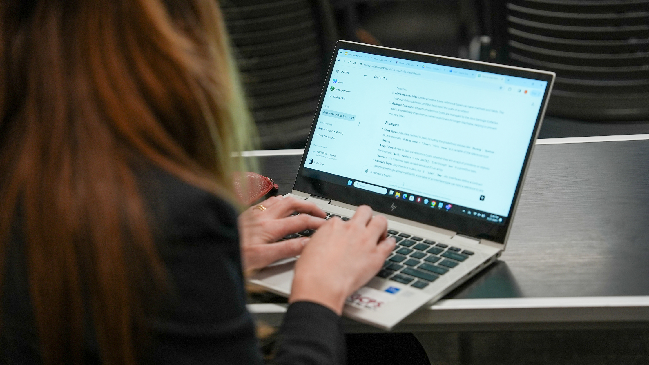 woman typing on computer