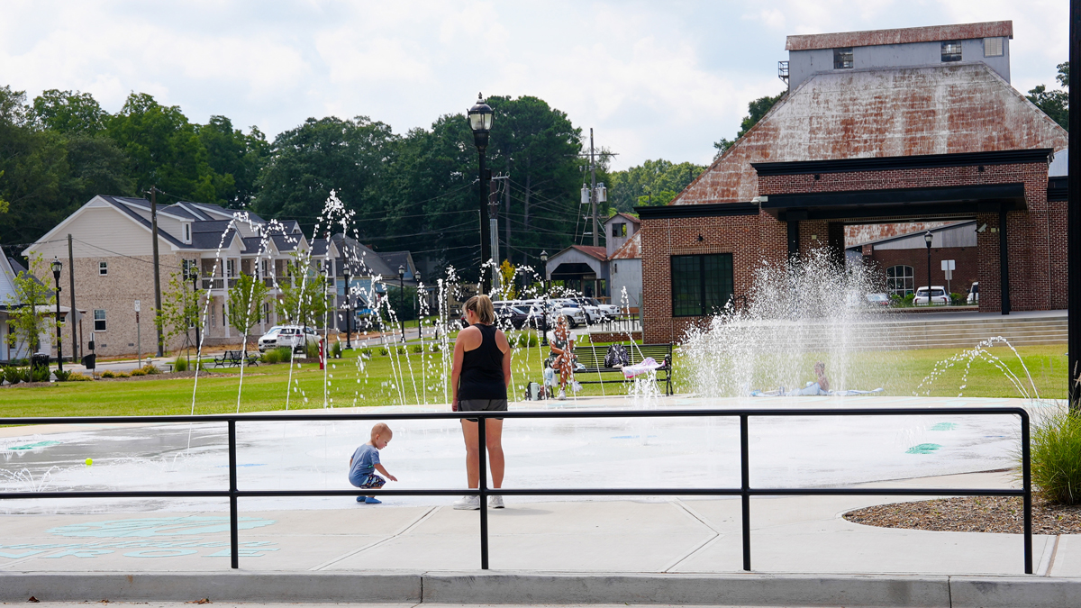 A splashpad is a welcome feature of Monroe’s Town Green, which won a Best Placemaking Project Award at a Georgia Downtown Conference last year.