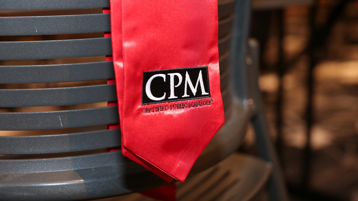 picture of CPM stole hanging over a chair.