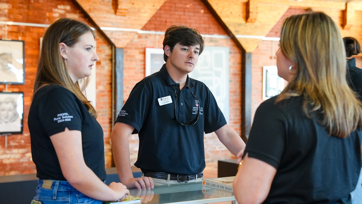 PROPEL Rural Scholars Robie Lucas, Chase Walker and Lydia Bellflower talk at the Cordele Railway Museum and Visitors Center. (Photo by Sara Ingram)