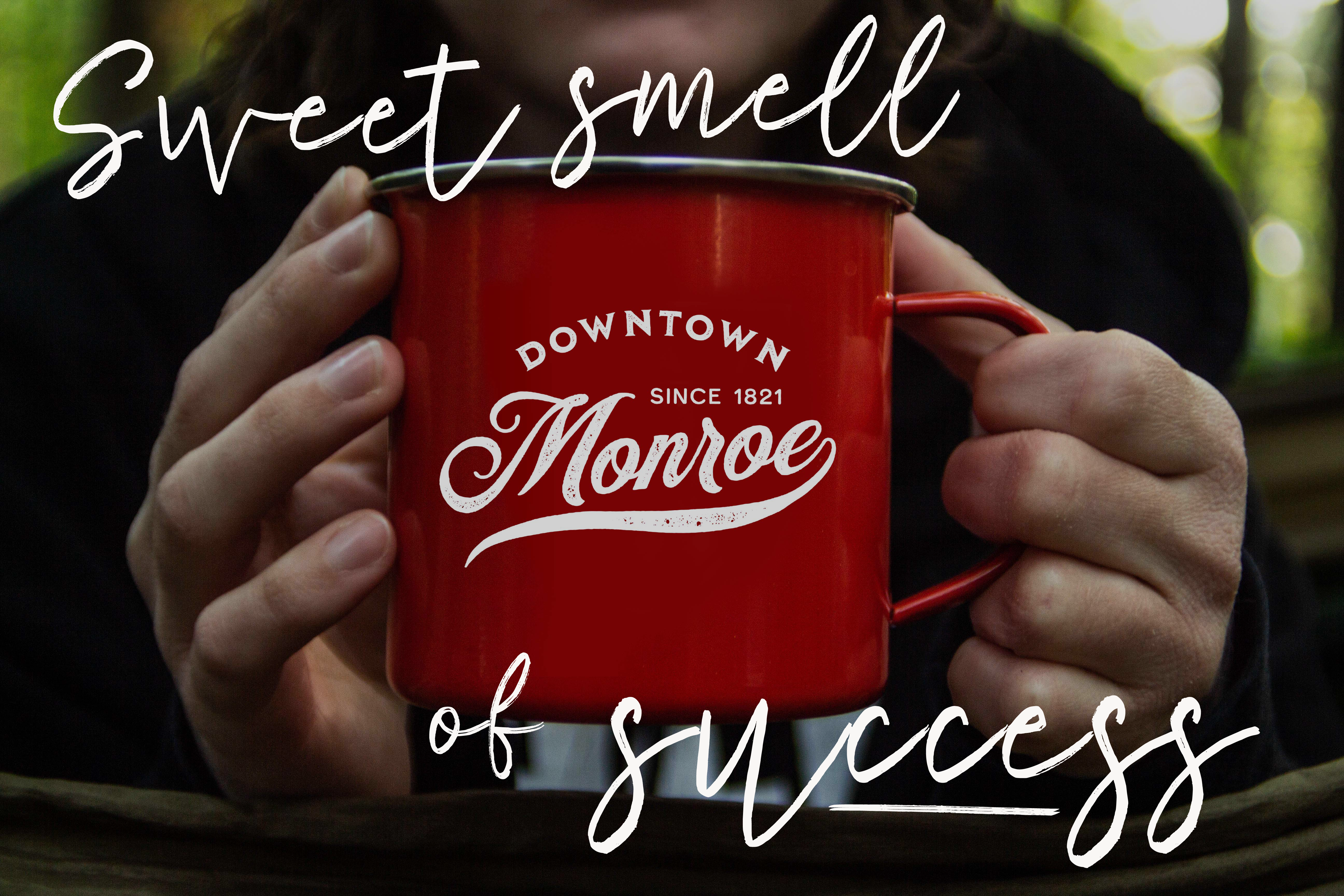 Image of coffee cup with new Monroe brand. Lead-in text reads Sweet Smell of Success