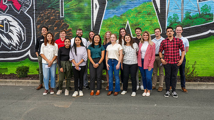 group of PROPEL Rural Scholars students stand in front of Baxley mural.